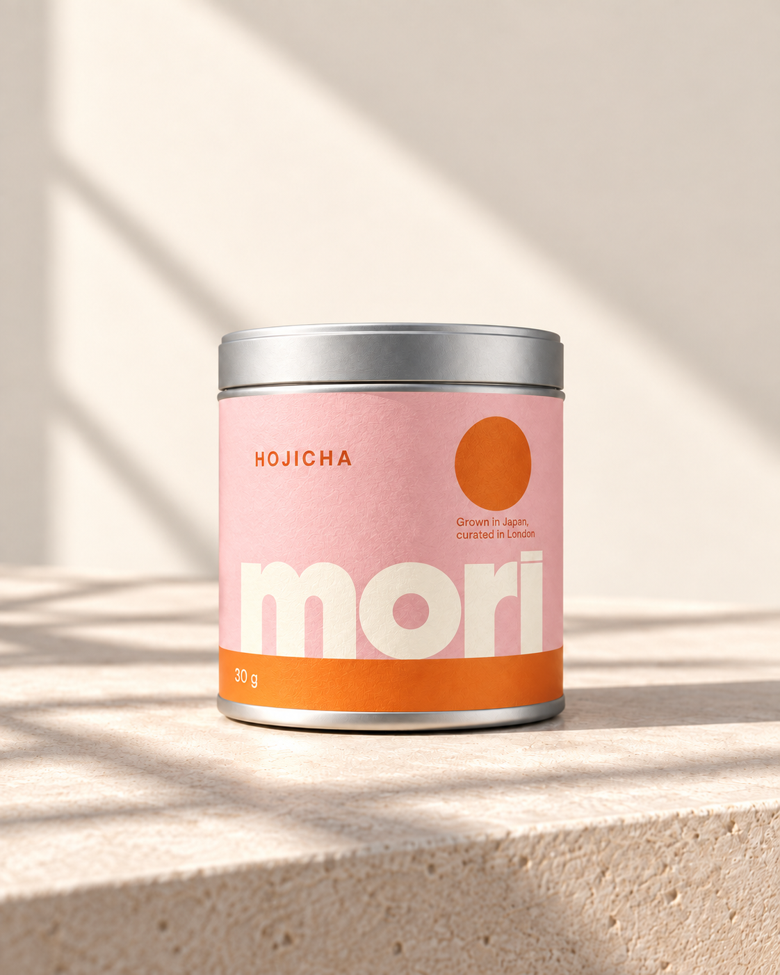 Mori Hojicha in a white tin with powder-pink and orange label