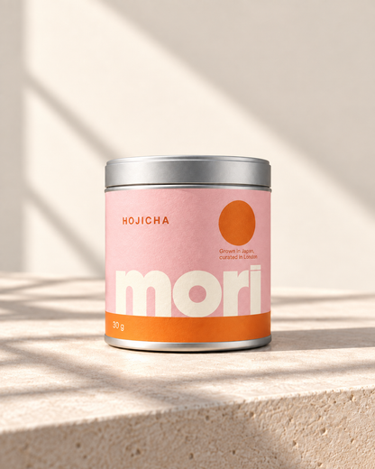Mori Hojicha in a white tin with powder-pink and orange label